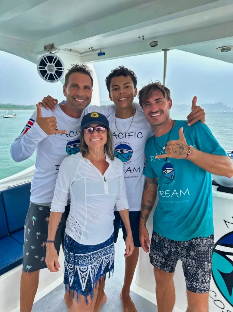 Guests and crew pose together on the boat deck after a combo tour in Nosara.