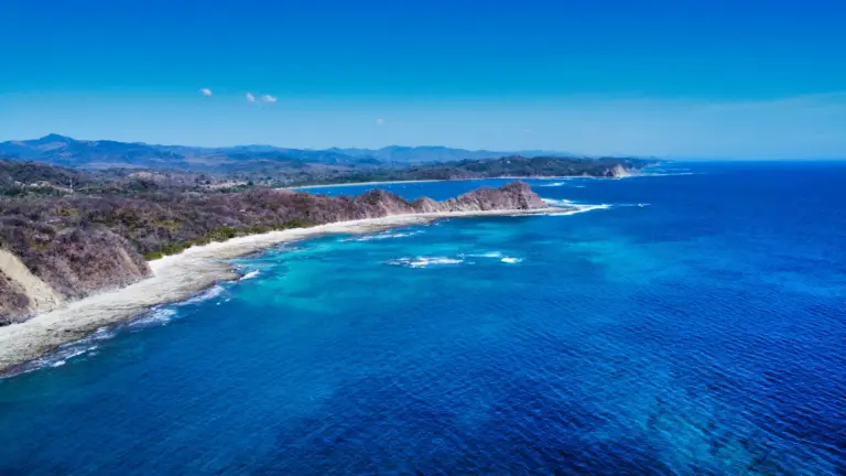 Aerial view of the empty beaches and blue water along the Guanacaste coast near Nosara.